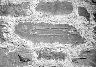 Detail of dagger in wall.