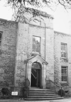 General view of the front entrance including an open pediment and pilasters surrounding the doorway seen from the North North East.