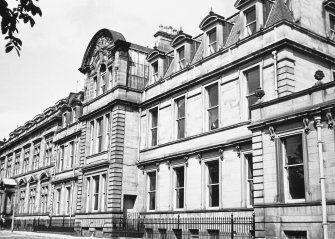 View of the buildings of the North side of George Square including part of the front of George Watson's Ladies College and the building later demolished to make way for the Hugh Robson Building, seen from the South East.