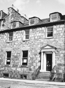 View of the front of the building seen from the South East.
In the ground floor windows can be seen two signs with 'Edinburgh Landscape' and 'The End' summing up one person's views on the George Square redevelopment.