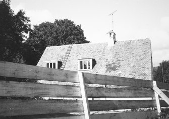 View of roof, dormer windows and chimney.
