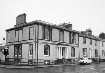 General view of nos 24, 25 Wellington Square from NE.