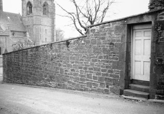 View from NE of garden wall showing doorway from Church Lane.