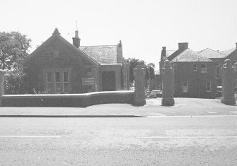 View of lodge including gatepiers from North.