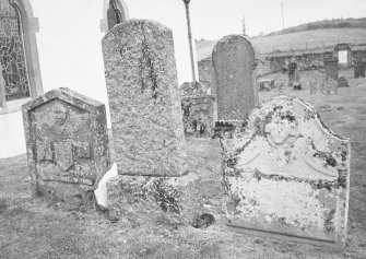 General view of three gravestones, two with winged souls.
