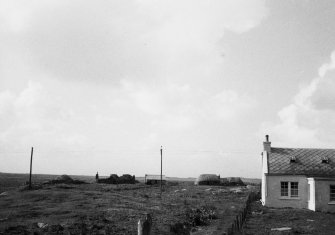 Distant view of unidentified blackhouses.