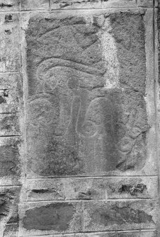 View of Pictish symbol stone (Fyvie no.1) built into gable of Fyvie Church.