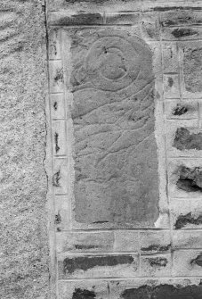 View of Pictish symbol stone (Fyvie no.2) built into gable of Fyvie Church.