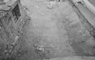 Jedburgh Abbey excavation archive
Frame 18: Area 2: Trench H, almost fully excavated, with replaced soil bank in place. From N.