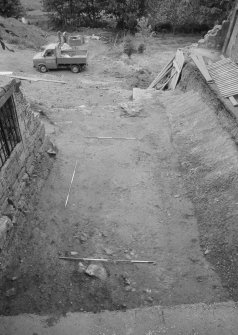 Jedburgh Abbey excavation archive
Frame 21: Area 2: Trench H, almost fully excavated, with replaced soil bank in place. From N.