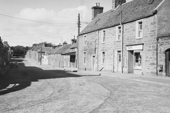 General view of buildings on the north side of Drummond Street, Muthill, including a cafe.