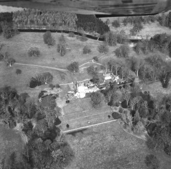 Oblique aerial view centred on country house from S.
