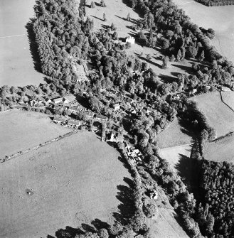 Oblique aerial view centred on the village of Longformacus with country house, walled garden, church and burial ground adjacent, taken from the WSW.