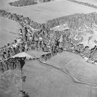 Oblique aerial view centred on the village of Longformacus with walled garden, church and burial ground adjacent, taken from the SW.