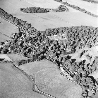 Oblique aerial view centred on the village of Longformacus with walled garden, church and burial ground adjacent, taken from the SSW.