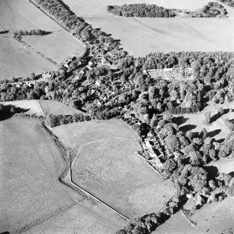Oblique aerial view centred on the village of Longformacus with walled garden, church and burial ground adjacent, taken from the S.