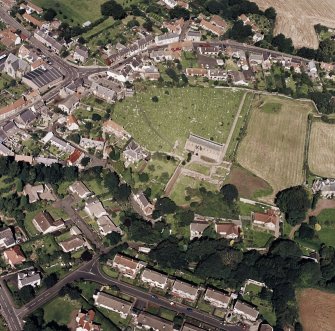 Oblique aerial view of Coldingham centred on the church, taken from the SSE.