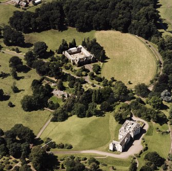 Oblique aerial view centred on the country house and stables, taken from the ESE.