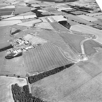 Oblique aerial view centred on the airfield, taken from the W.