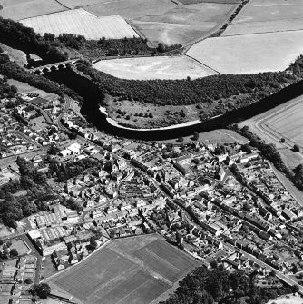 Oblique aerial view centred on the town of Coldstream with road bridge adjacent, taken from the W.