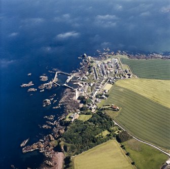 Oblique aerial view centred on the village, with the harbour adjacent, taken from the NNW.