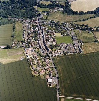 Oblique aerial view centred on Ayton village, taken from the NW.