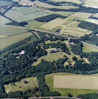 Oblique aerial view centred on the country house, with the farmsteading and burial ground adjacent, taken from the SSE.
