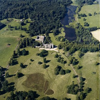 Oblique aerial view centred on the country house and tower-house, taken from the S.