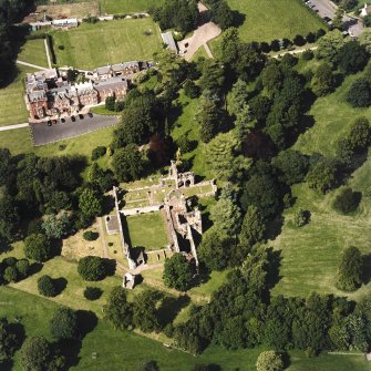 Dryburgh Abbey, oblique aerial view, taken from the SSW, centred on the abbey, with Dryburgh House Hotel in the top left-hand corner.