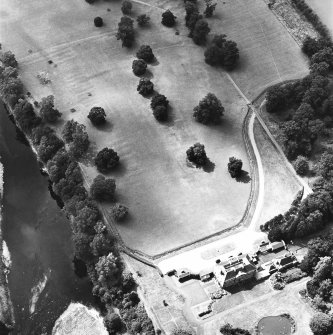 Oblique aerial view, taken from the ENE, centred on the country house and the formal gardens.