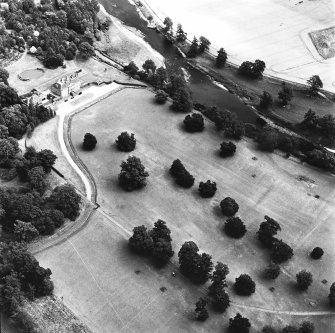 Oblique aerial view, taken from the WNW, centred on the country house and the formal gardens.