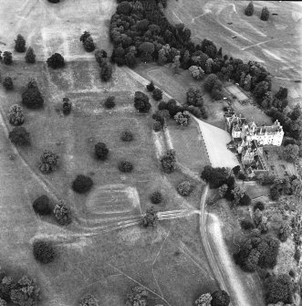 Oblique aerial view from SSE showing the castle and the surrounding park with possible evidence of temporary stalls and huts for the horse trials.