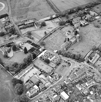 General oblique aerial view centred on Harmony house and the remains of the abbey, taken from the SW.