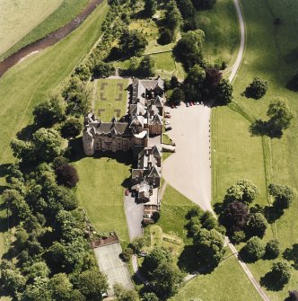 Oblique aerial view centred on the castle, taken from the NW.