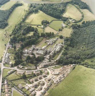 Oblique aerial view centred on the asylum and hospital, taken from the NE.