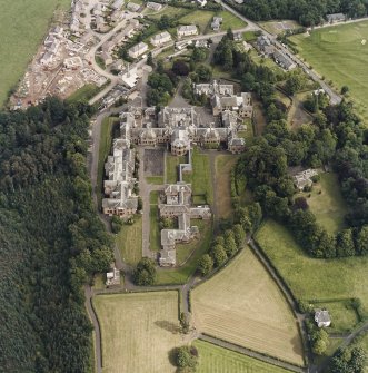 Oblique aerial view centred on the asylum and hospital, taken from the WSW.