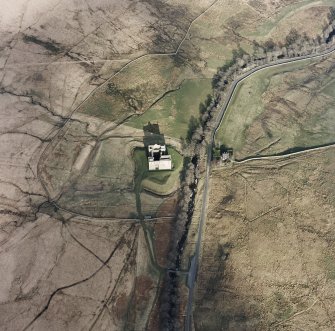 Oblique aerial view centred on the remains of the castle, taken from the WSW.