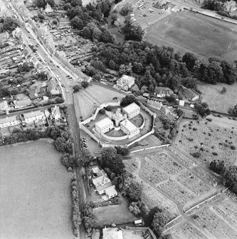 Oblique aerial view centred on the jail, burial ground and The Hermitage, taken from the WSW.