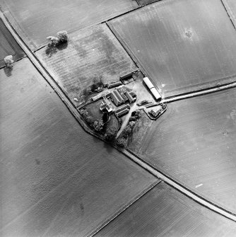 Oblique aerial view centred on the farmsteading, taken from the NE