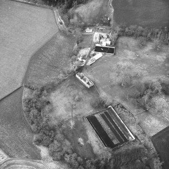 Oblique aerial view centred on country house from ESE.