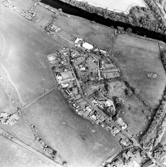 Oblique aerial view of Roxburgh centred on the church and churchyard, taken from the W.