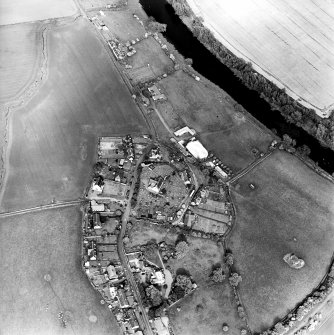 Oblique aerial view of Roxburgh centred on the church and churchyard, taken from the WSW.