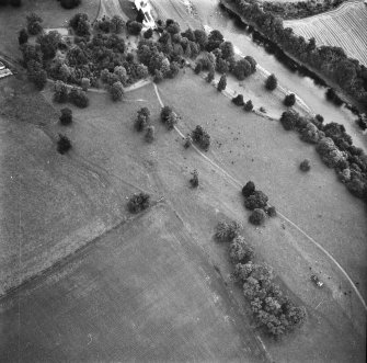 Oblique aerial view centred on the deserted medieval village earthworks from W.