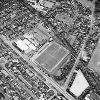 Oblique aerial view, centred on the football ground, taken from the SE