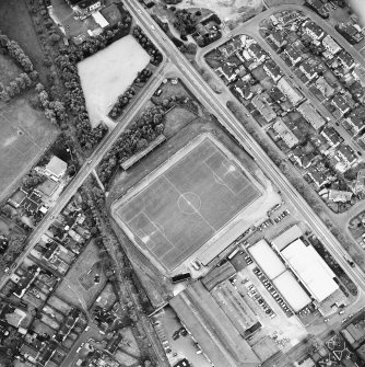 Oblique aerial view, centred on the football ground, taken from the NW