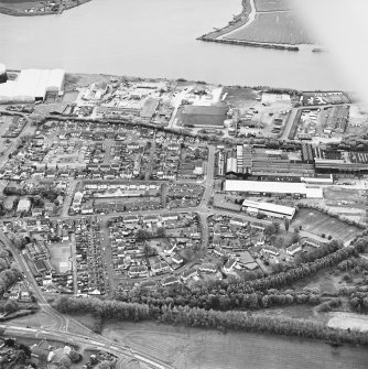 Oblique aerial view of southern Alloa and industrial units close to the River Forth, taken from the N