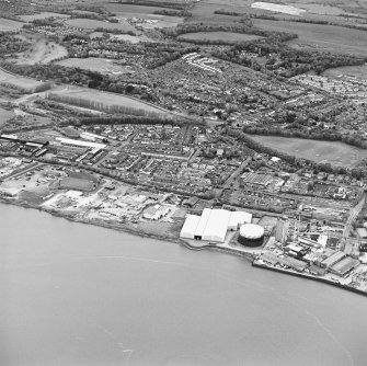 Oblique aerial view of southern Alloa and industrial units close to the River Forth, taken from the S