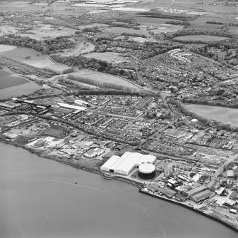 Oblique aerial view of southern Alloa and industrial units close to the River Forth, taken from the S