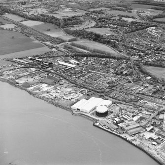 Oblique aerial view of southern Alloa and industrial units close to the River Forth, taken from the SSE