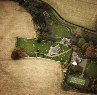 Oblique aerial view centred on the church and manse, taken from the WSW.